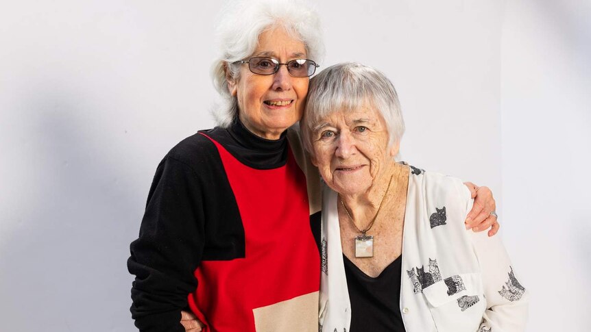Phyllis Papps and Francesca Curtis pose for a photo against a white backdrop.