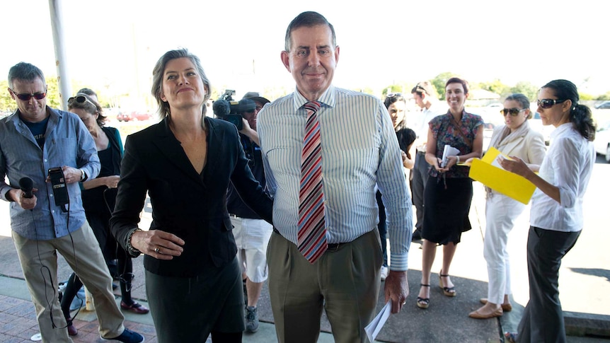 Peter Slipper and his wife Inge leave a press conference on the Sunshine Coast