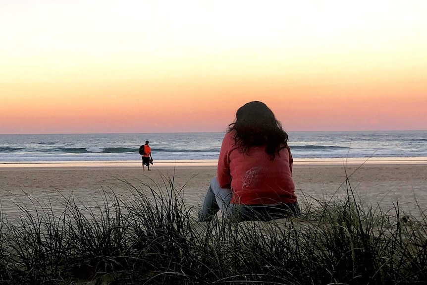 "Jayne" stares at the sunset on a Gold Coast beach