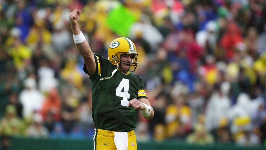 Green Bay Packers quarterback Brett Favre signals a touchdown against Detroit in September 2001.
