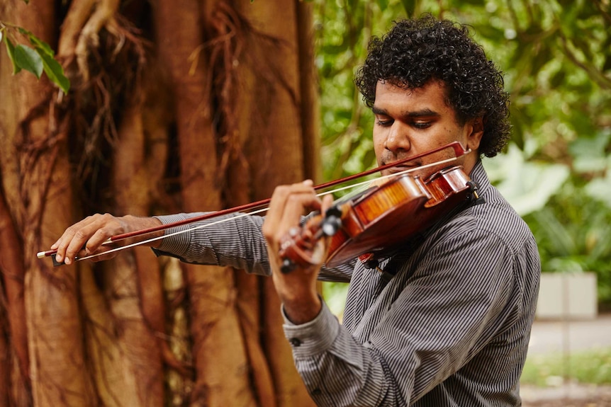 A man plays the violin.