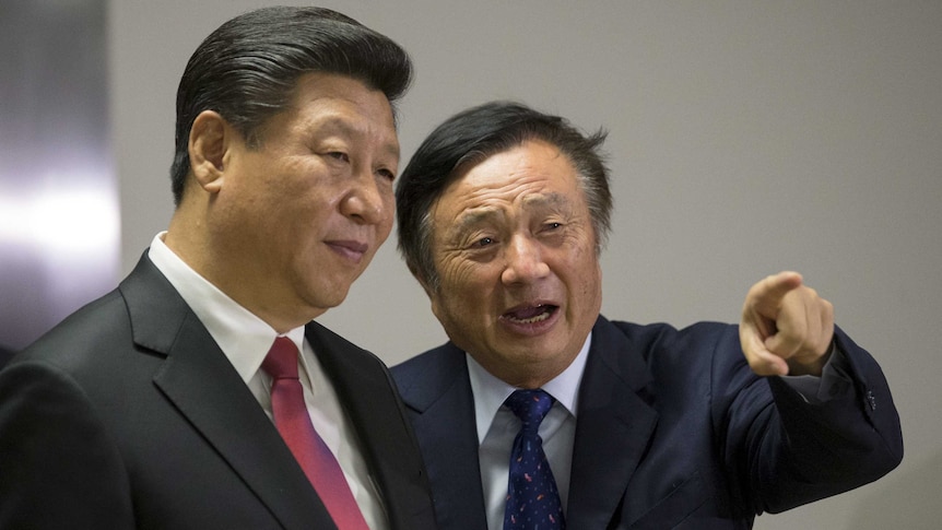 Chinese President Xi Jinping pauses as Ren Zhengfei shows him around Huawei's London offices, Mr Ren is pointing at something.