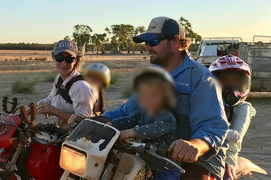 A woman and man on motorbikes, with blurred faces of their children riding with them.