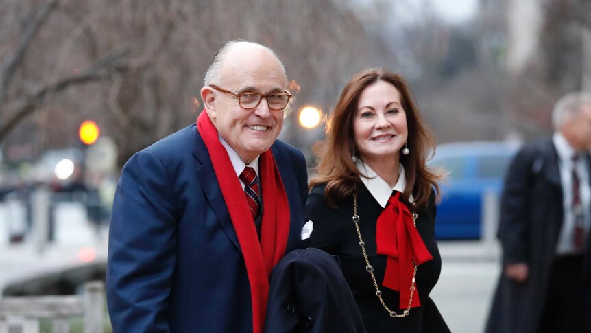 Rudy Giuliani arrives at the church service with his wife