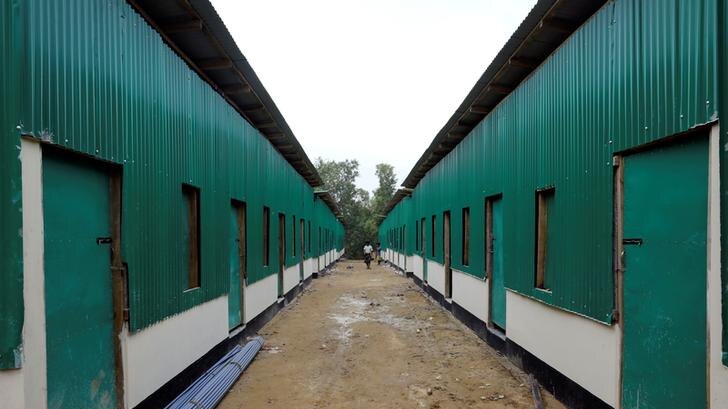 A stark shelter building painted green at Rohingya repatriation centre in Gunndum near Cox's Bazar, Bangladesh, on a grey day