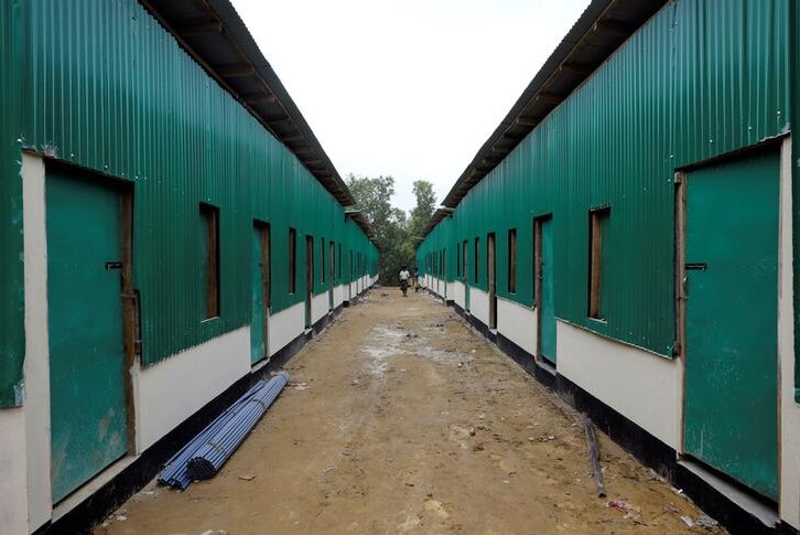 A stark shelter building painted green at Rohingya repatriation centre in Gunndum near Cox's Bazar, Bangladesh, on a grey day