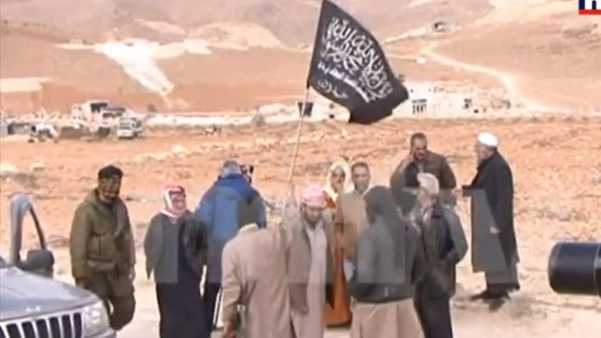 A still of the footage of the prisoner swap between Lebanon and Nusra Front.