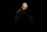 Midnight Oil frontman Peter Garrett poses cloaked in shadow