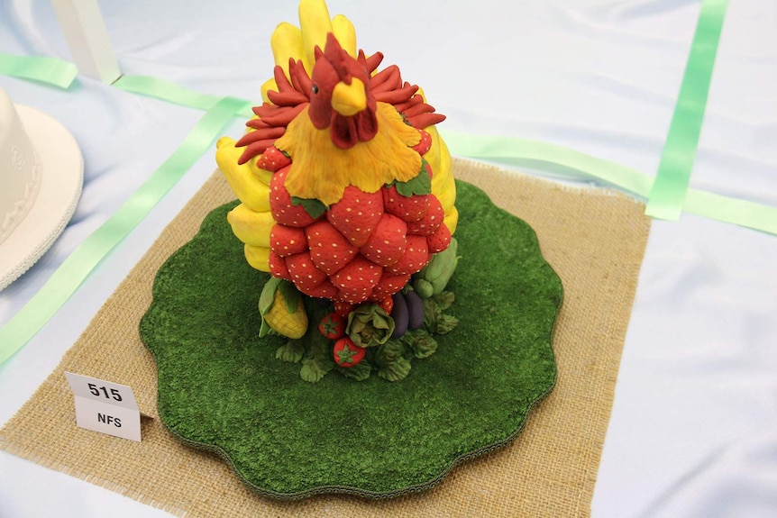 A multi-coloured rooster cake