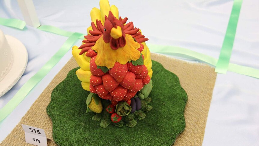 A multi-coloured rooster cake