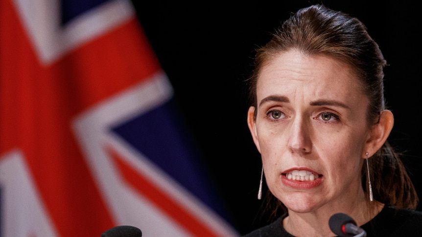 NZ PM Jacinda Ardern addresses a press conference from a lectern in Wellington, New Zealand.