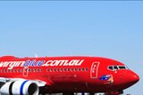 Virgin Blue says rising fuel costs have forced it to review the amount of flights into places like the Gold Coast.