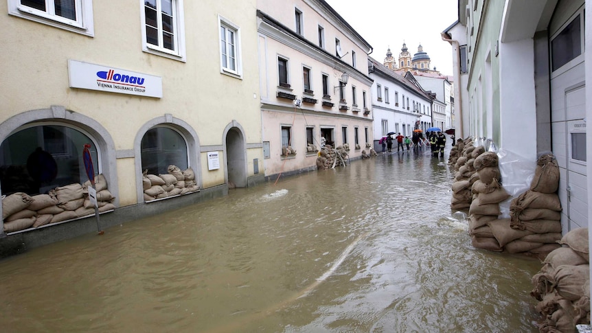 Sandbags line buildings in flooded Melk.