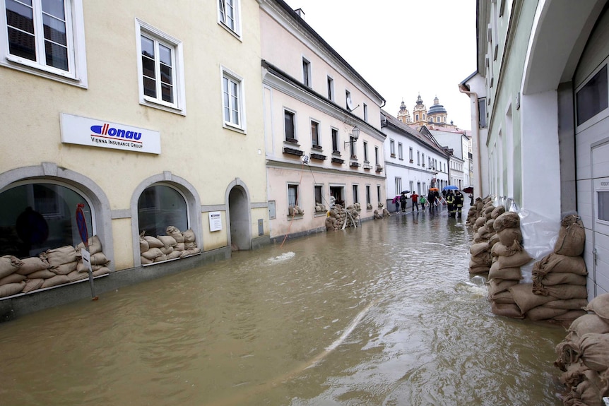 Sandbags line buildings in flooded Melk.