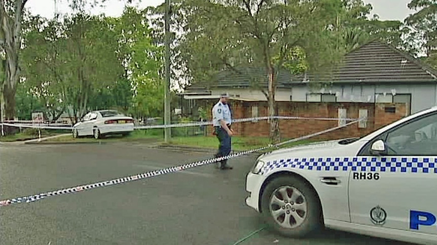 Police attend a crime scene in Guildford