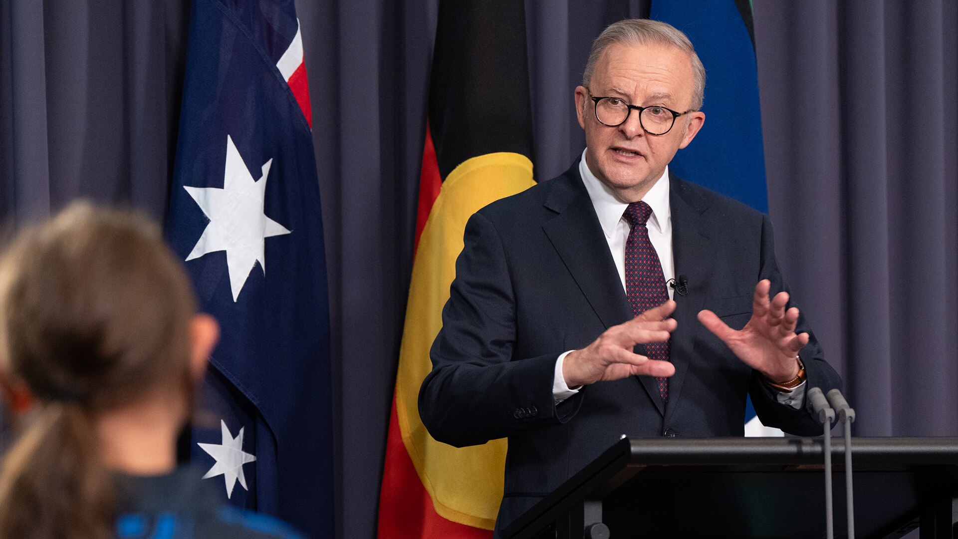 Australian Prime Minister Anthony Albanese at press conference podium