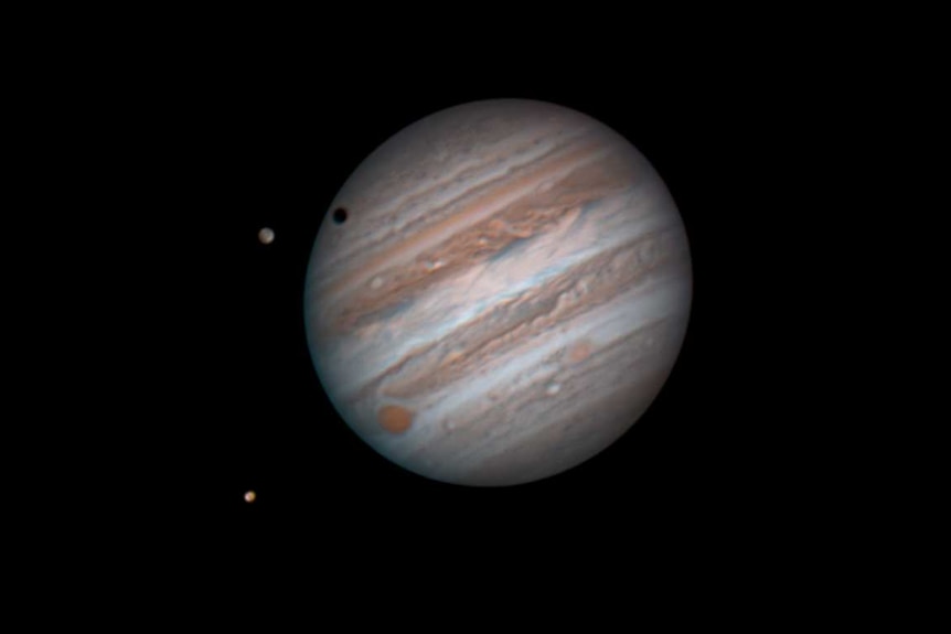 Jupiter and its moons Ganymede and Io