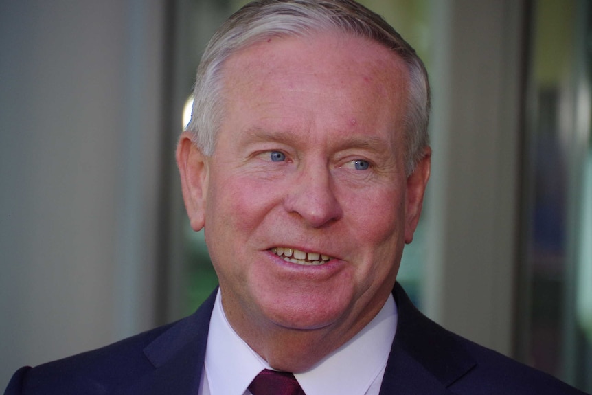 A tight headshot of a smiling former Premier Colin Barnett.