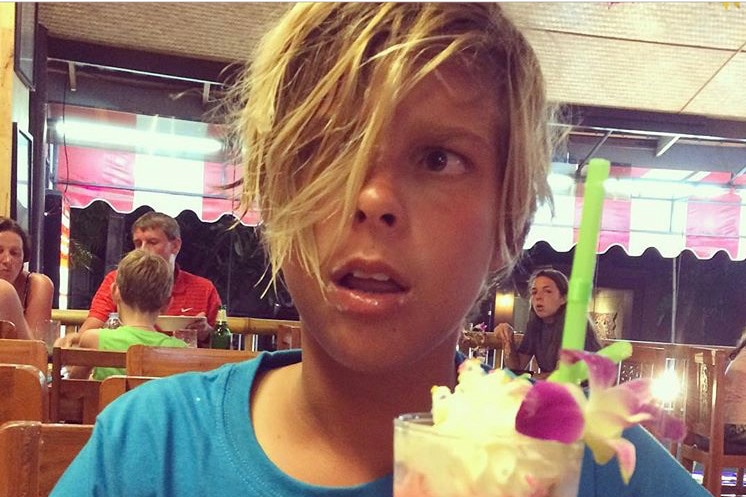 A child with a milkshake