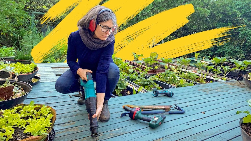 A woman uses an electric saw on a deck, for a story about frugal living tips.