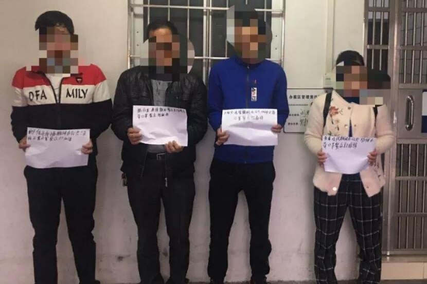 Four Chinese residents hold guarantee letters with faces blurred after being arrested for playing Mahjong without wearing masks.