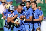 A group of Western Force players celebrate during a match.