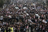 People attend a protest in Kabul against the killing of seven members of the Hazara minority