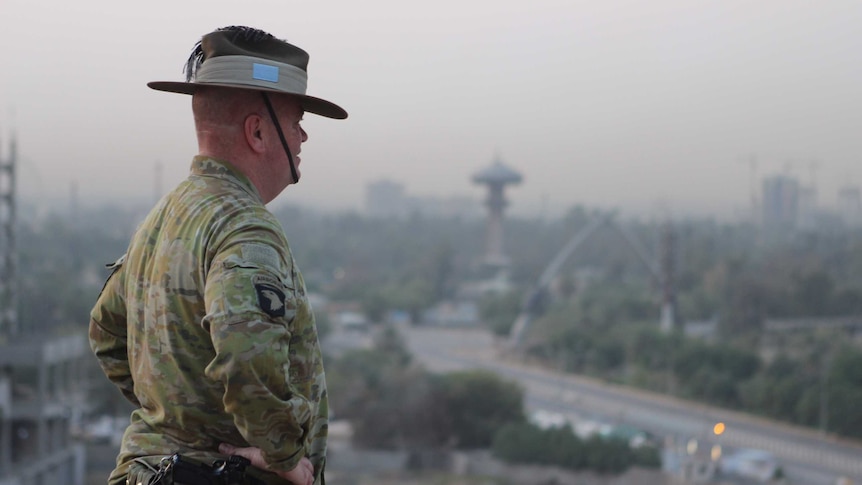 Brigadier Roger Noble looks over the Baghdad skyline.