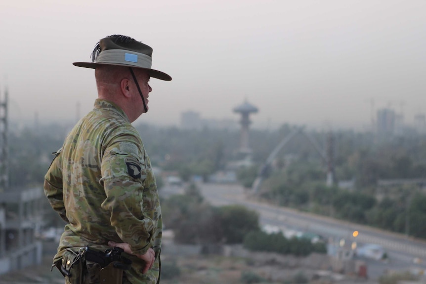 Brigadier Roger Noble looks over the Baghdad skyline.