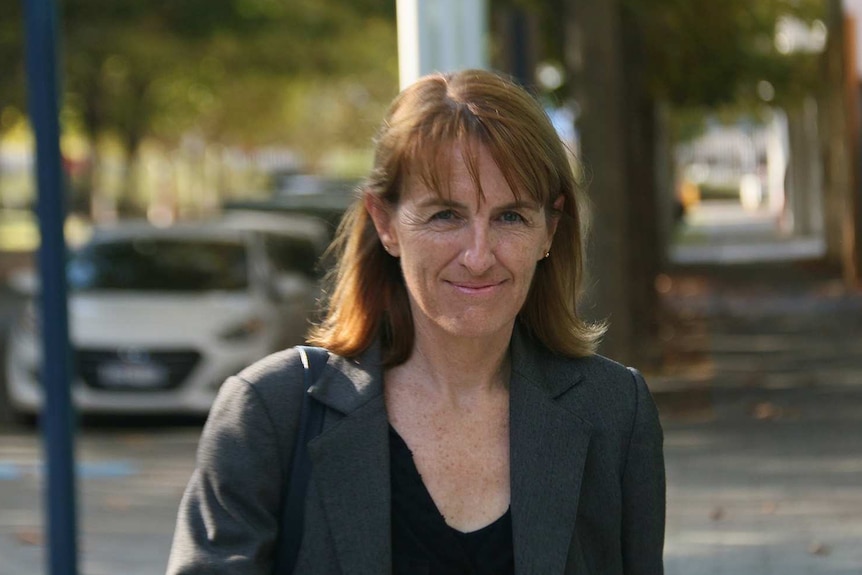 Celia Hammond walking down a street outside the ABC.