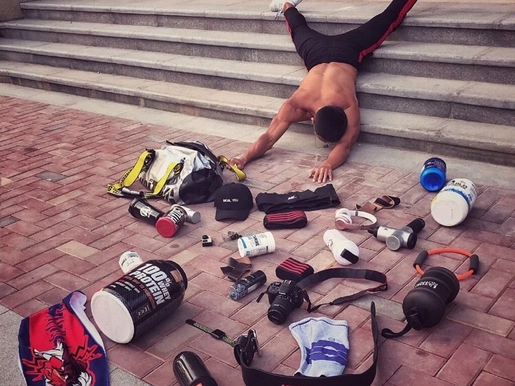 A Chinese man posed for the challenge with all his spots-related items on the ground, while he was lying face down on the stairs