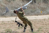 An Israeli soldier prepares to launch an Israeli army's Skylark I unmanned drone aircraft.