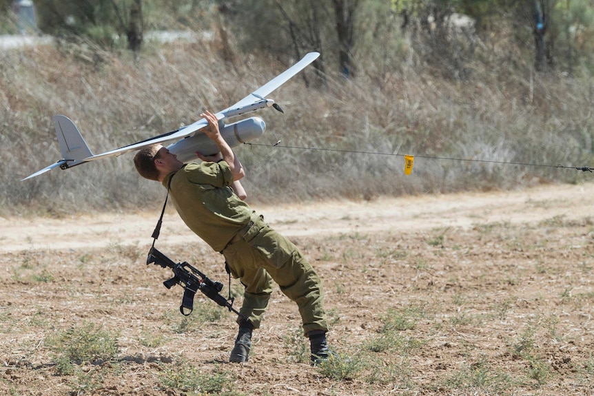 An Israeli soldier prepares to launch an Israeli army's Skylark I unmanned drone aircraft.