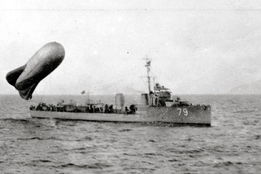 A warship and observation balloon