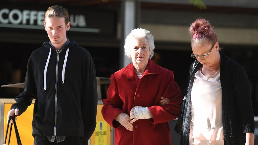Manslaughter victim Darren Pullar's partner Collette Dunn and his son Aidan outside court.