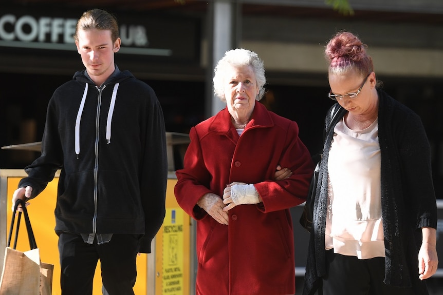 Manslaughter victim Darren Pullar's partner Collette Dunn and his son Aidan outside court.