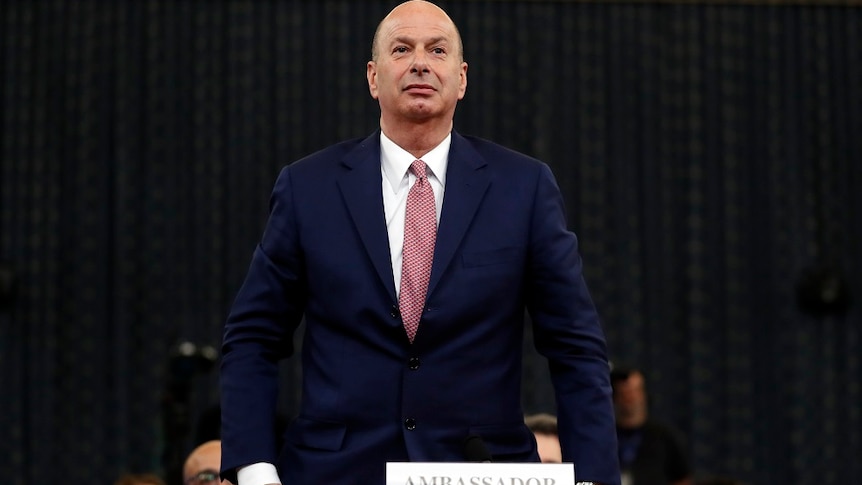 U.S. Ambassador to the European Union Gordon Sondland standing in a hearing room.