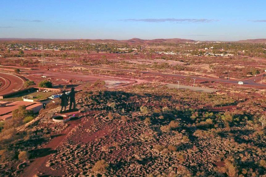 A view of a remote town from a mountain lookout.