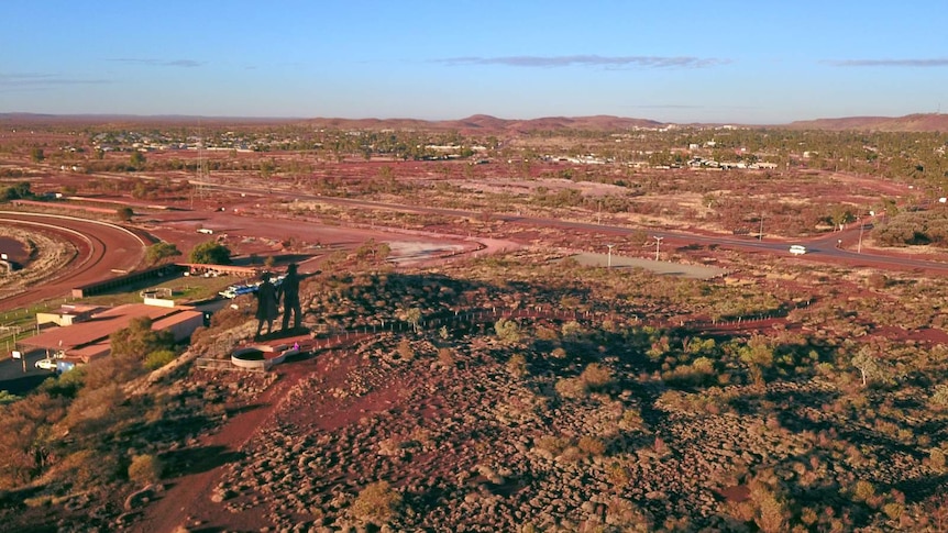 A view of a remote town from a mountain lookout.