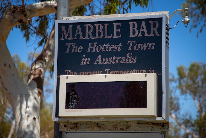 sign with Marble Bar Hottest Town in Australia with a blank screen