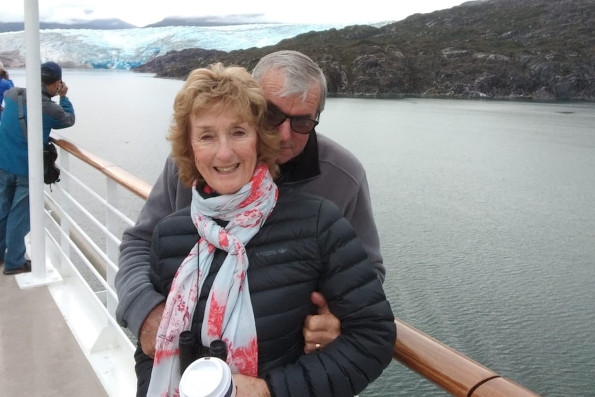 Helen and Eddie Pawlowitsch stand on the deck of a cruise ship.