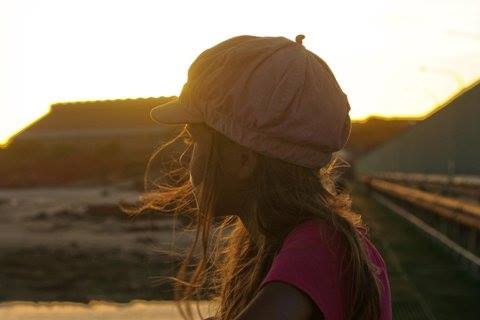 A girl in the sunset shadow