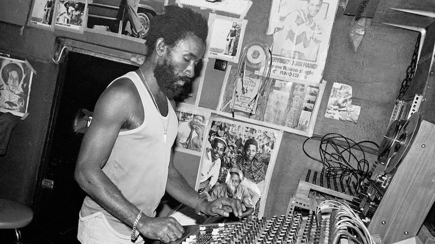 Jamaican producer Lee "Scratch" Perry working in studio