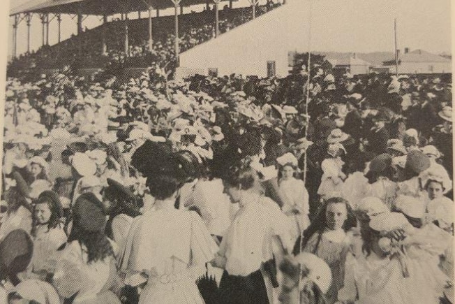 An old image of Maitland Showground with hundred of people filling the grandstand