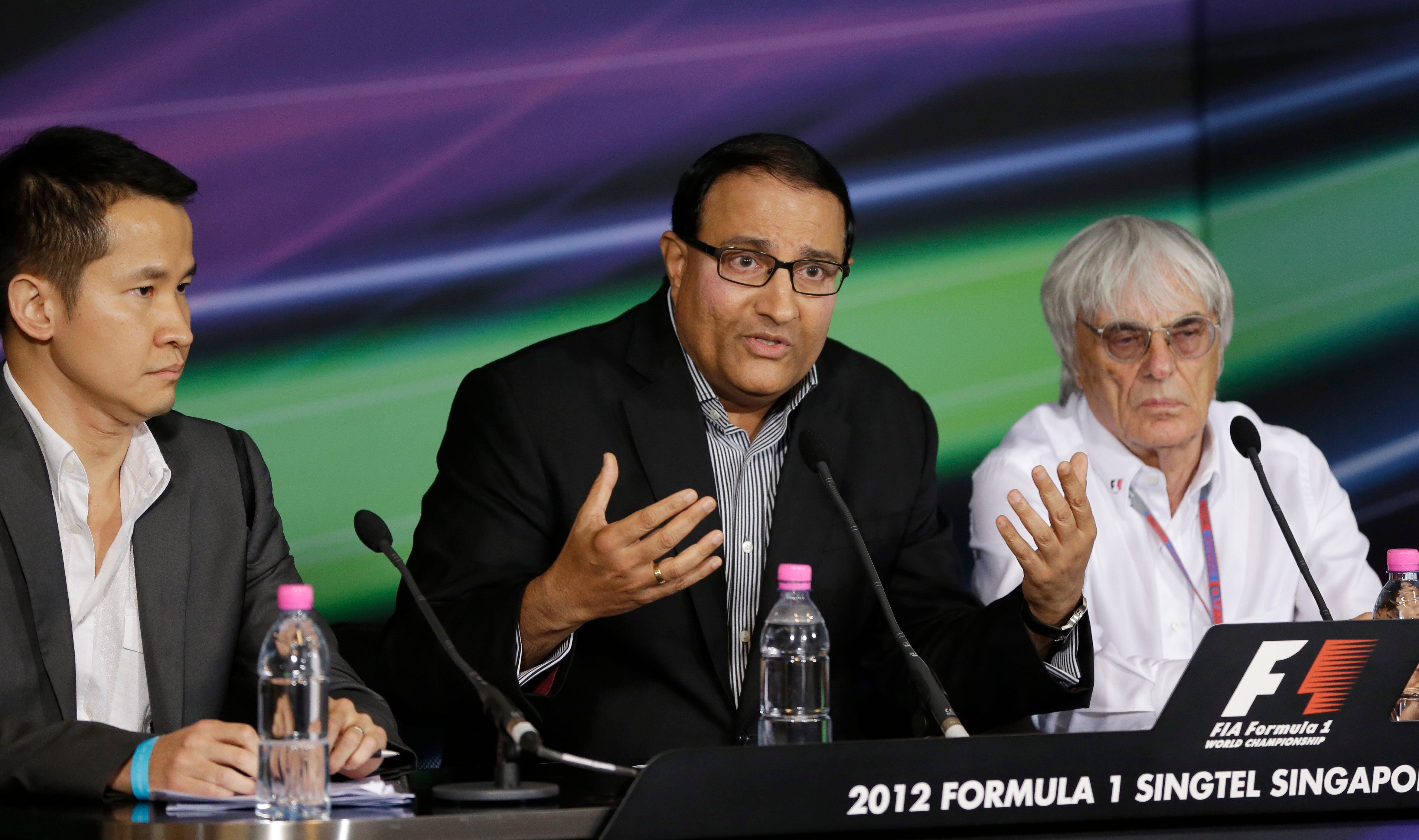 Lionel Yeo, S. Iswaran and Bernie Ecclestone hold a press conference. 