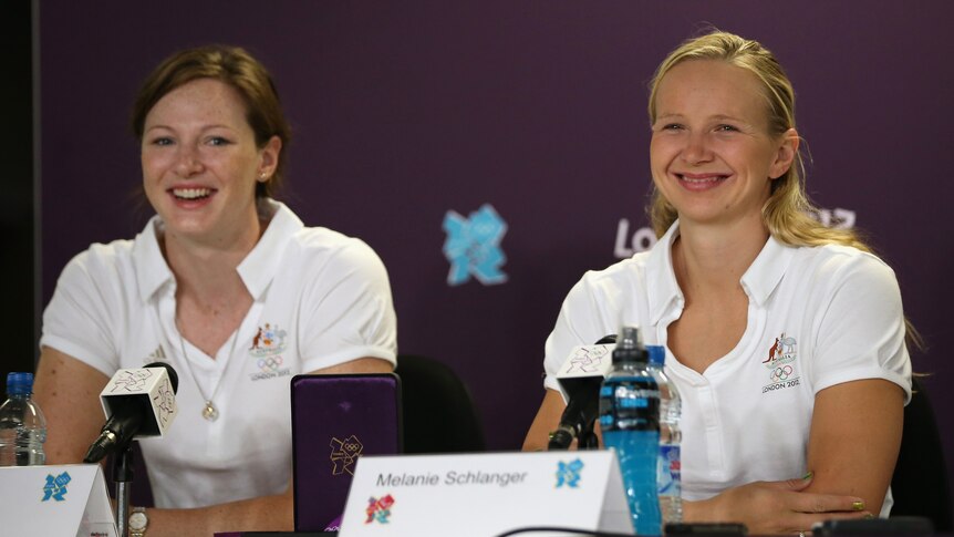 All smiles ... Cate Campbell (L) and Melanie Schlanger speak to the media a day after their gold medal performance