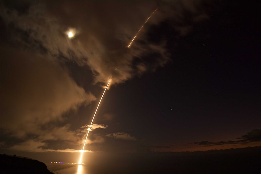 A missile lights up the night sky.