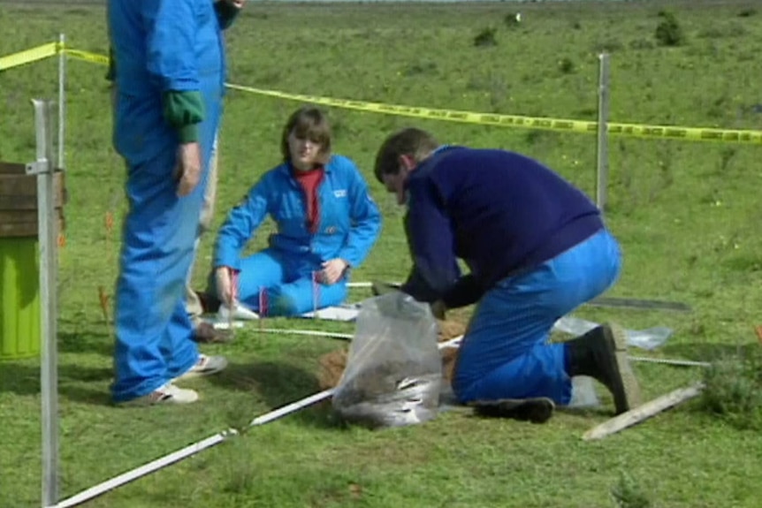 A police dig in a field.