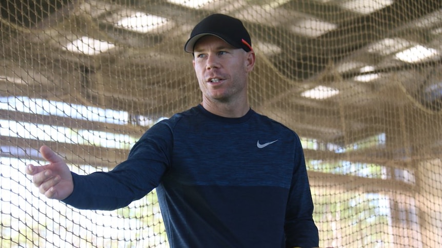 David Warner throws a cricket ball in Darwin.