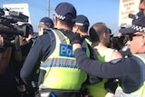 Police arrest protesters outside the World Congress of Families.